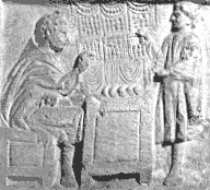 Venditore di pane con un cliente in un bassorilievo gallo-romano.